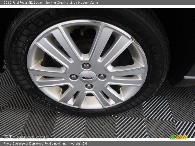 Sterling Grey Metallic / Medium Stone 2010 Ford Focus SEL Sedan