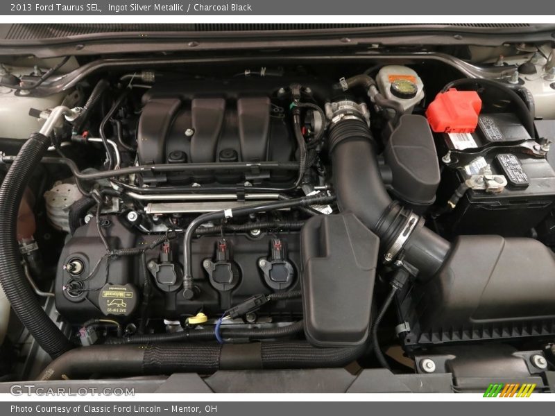 Ingot Silver Metallic / Charcoal Black 2013 Ford Taurus SEL