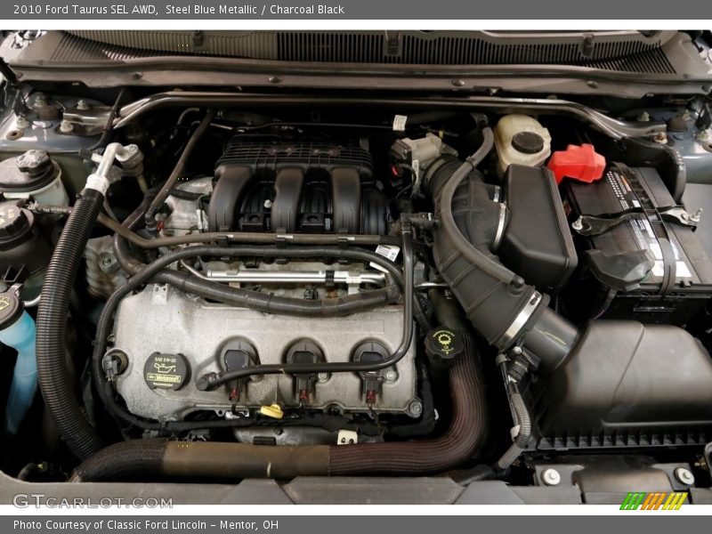 Steel Blue Metallic / Charcoal Black 2010 Ford Taurus SEL AWD