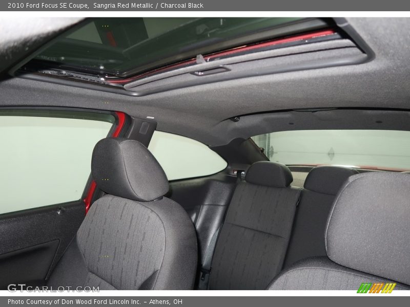 Sangria Red Metallic / Charcoal Black 2010 Ford Focus SE Coupe