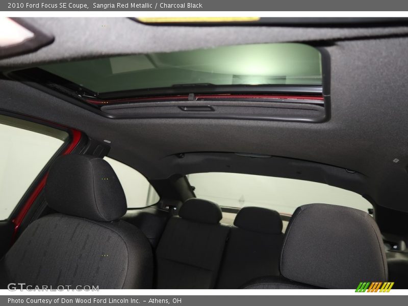 Sangria Red Metallic / Charcoal Black 2010 Ford Focus SE Coupe