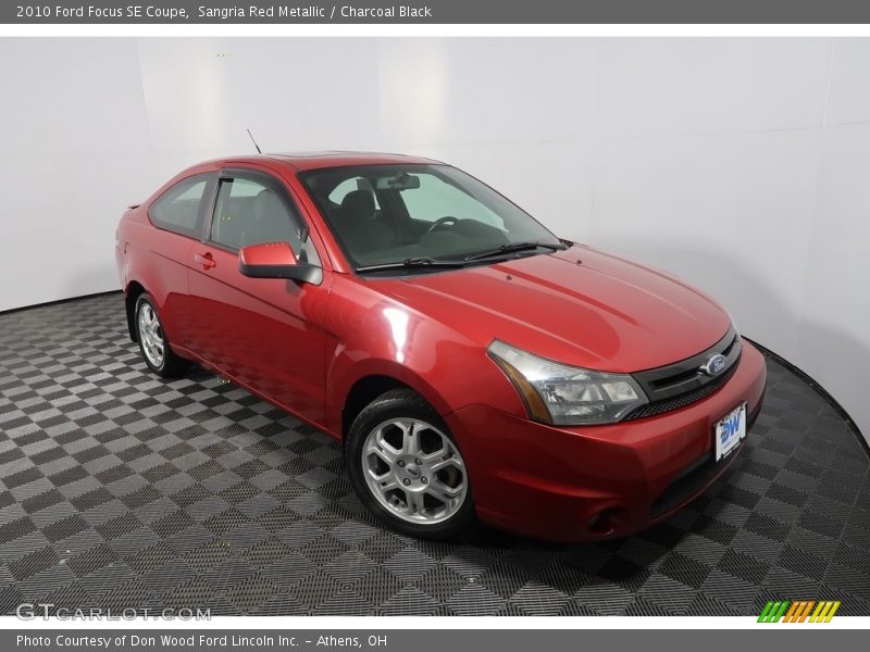 Sangria Red Metallic / Charcoal Black 2010 Ford Focus SE Coupe