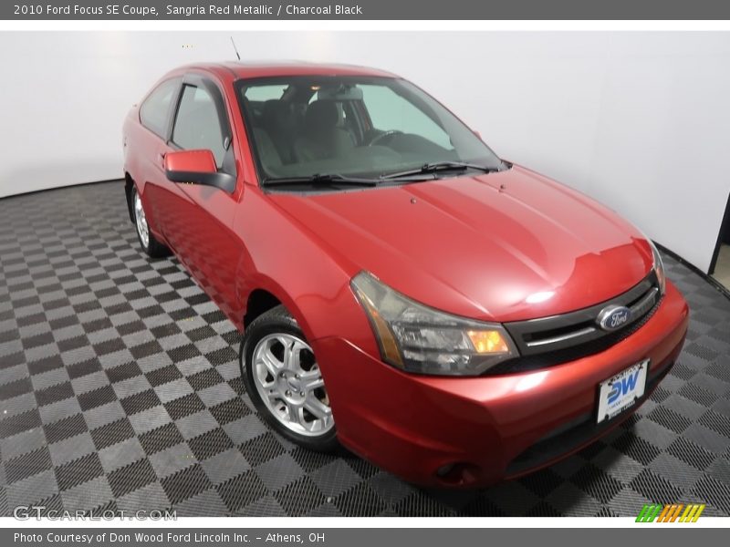 Sangria Red Metallic / Charcoal Black 2010 Ford Focus SE Coupe
