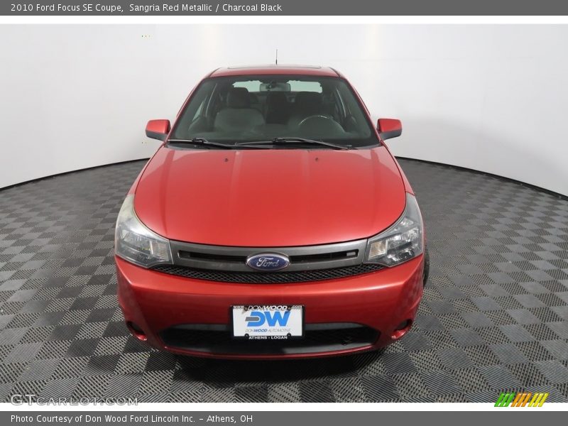 Sangria Red Metallic / Charcoal Black 2010 Ford Focus SE Coupe