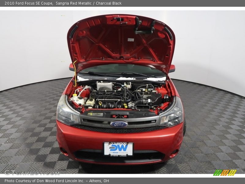 Sangria Red Metallic / Charcoal Black 2010 Ford Focus SE Coupe