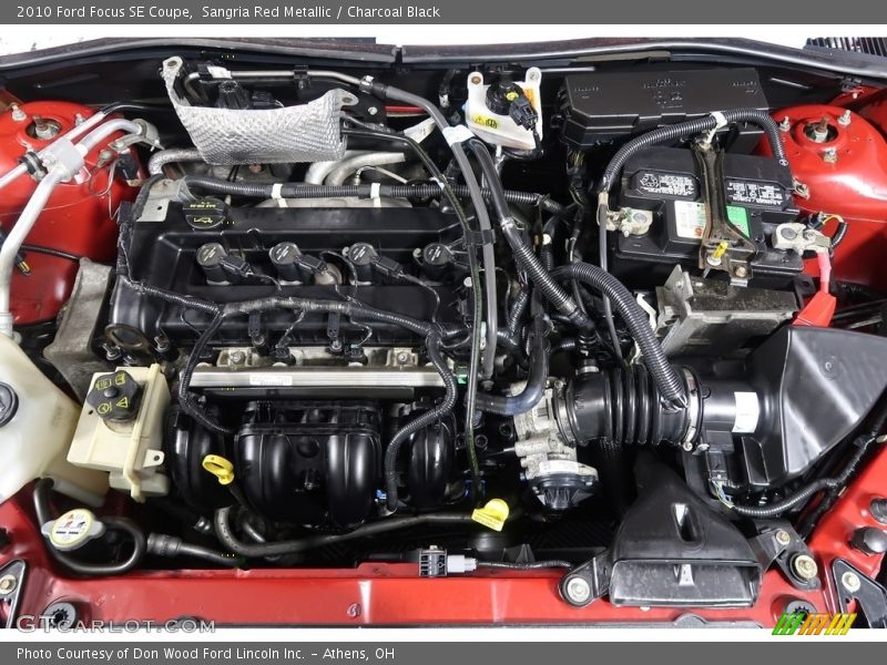 Sangria Red Metallic / Charcoal Black 2010 Ford Focus SE Coupe
