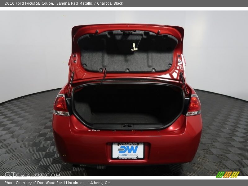 Sangria Red Metallic / Charcoal Black 2010 Ford Focus SE Coupe