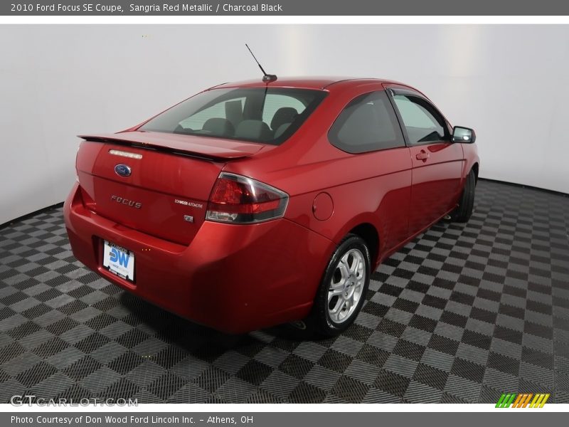 Sangria Red Metallic / Charcoal Black 2010 Ford Focus SE Coupe
