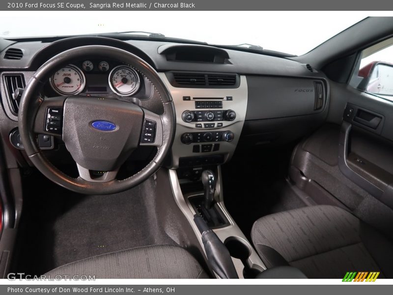 Sangria Red Metallic / Charcoal Black 2010 Ford Focus SE Coupe