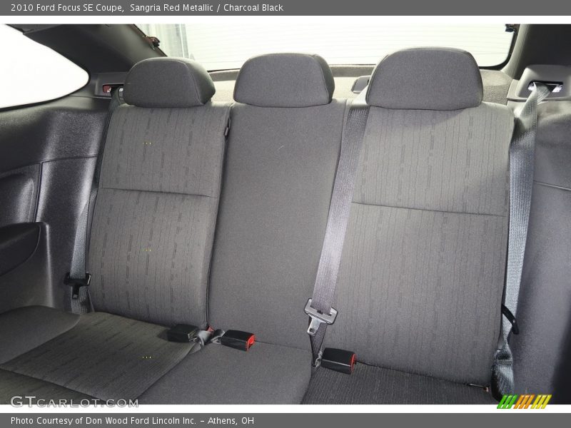 Sangria Red Metallic / Charcoal Black 2010 Ford Focus SE Coupe