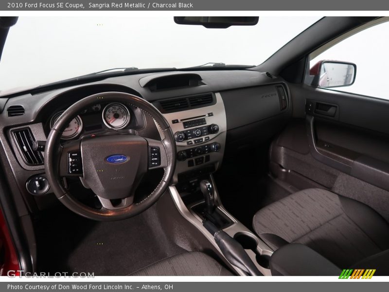 Sangria Red Metallic / Charcoal Black 2010 Ford Focus SE Coupe