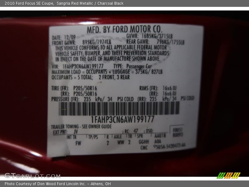 Sangria Red Metallic / Charcoal Black 2010 Ford Focus SE Coupe
