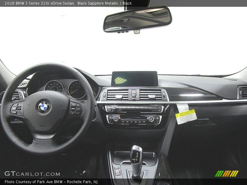 Black Sapphire Metallic / Black 2018 BMW 3 Series 320i xDrive Sedan