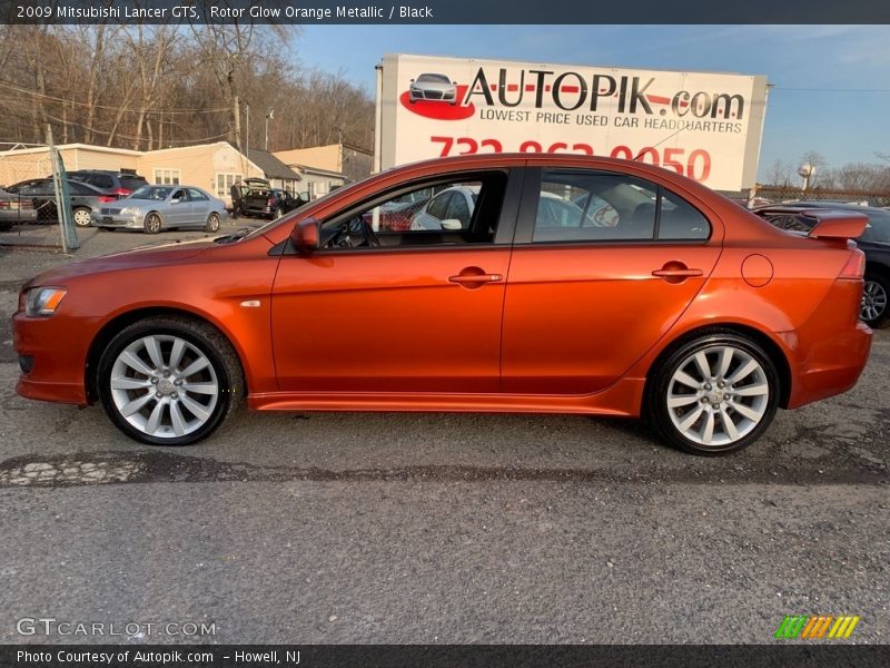 Rotor Glow Orange Metallic / Black 2009 Mitsubishi Lancer GTS