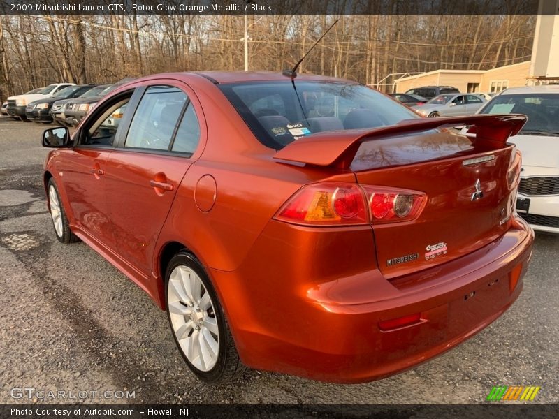 Rotor Glow Orange Metallic / Black 2009 Mitsubishi Lancer GTS
