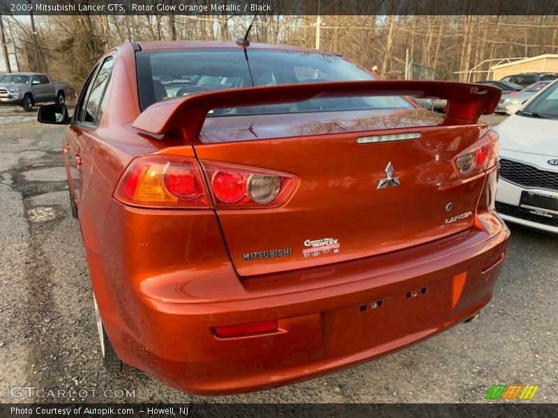 Rotor Glow Orange Metallic / Black 2009 Mitsubishi Lancer GTS