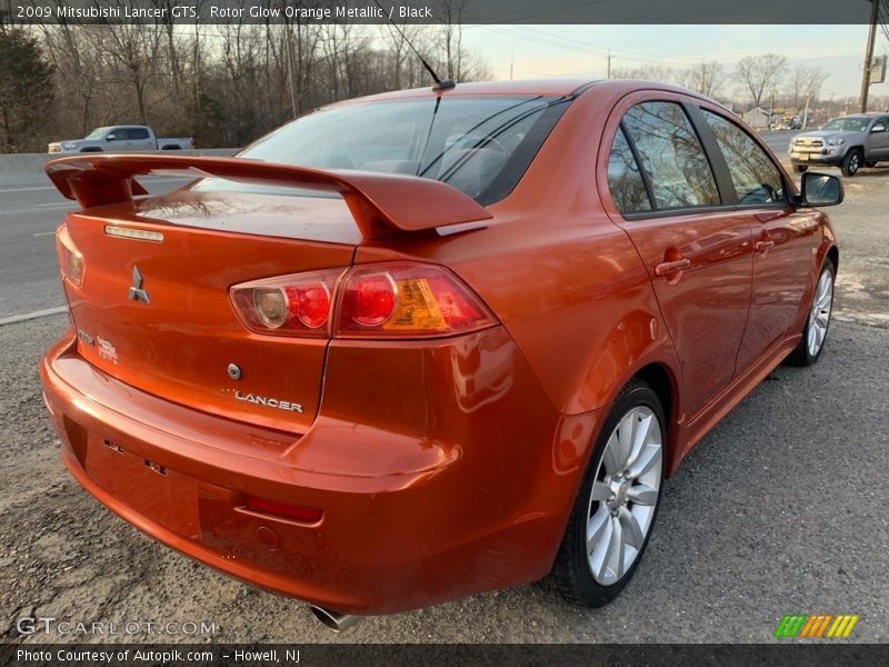 Rotor Glow Orange Metallic / Black 2009 Mitsubishi Lancer GTS