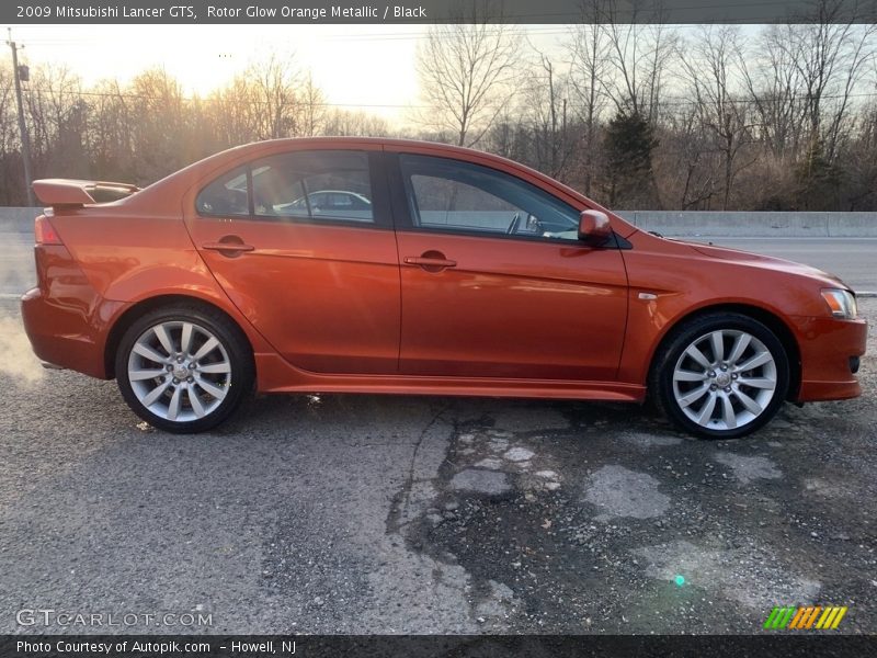 Rotor Glow Orange Metallic / Black 2009 Mitsubishi Lancer GTS