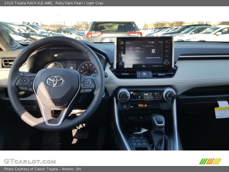 Ruby Flare Pearl / Light Gray 2019 Toyota RAV4 XLE AWD