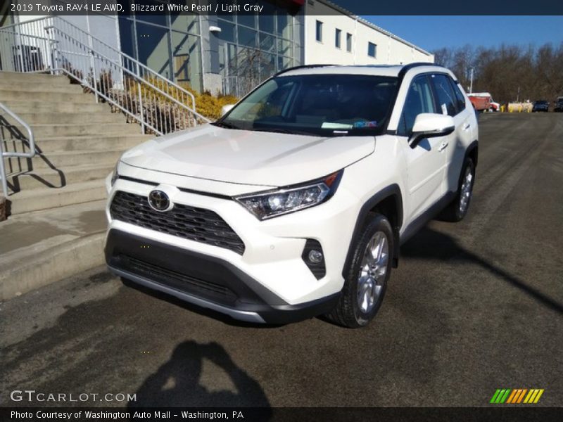 Blizzard White Pearl / Light Gray 2019 Toyota RAV4 LE AWD