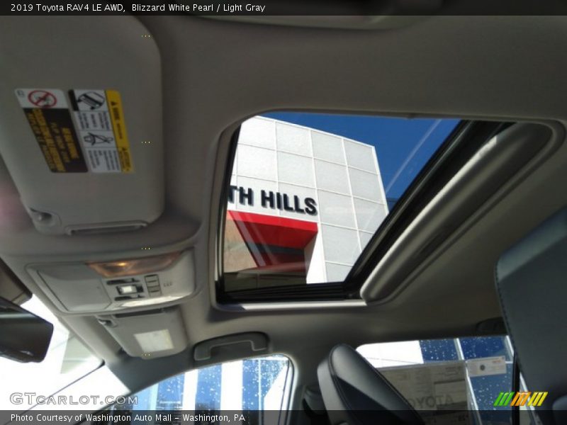 Blizzard White Pearl / Light Gray 2019 Toyota RAV4 LE AWD