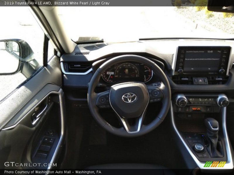 Blizzard White Pearl / Light Gray 2019 Toyota RAV4 LE AWD