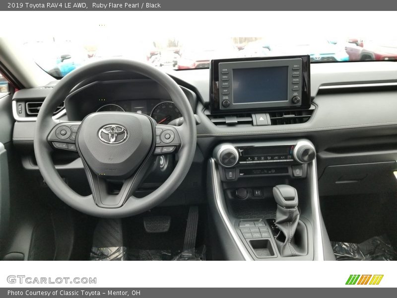 Ruby Flare Pearl / Black 2019 Toyota RAV4 LE AWD