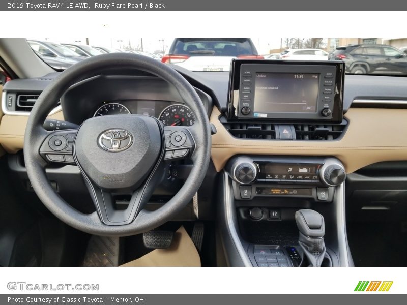 Ruby Flare Pearl / Black 2019 Toyota RAV4 LE AWD