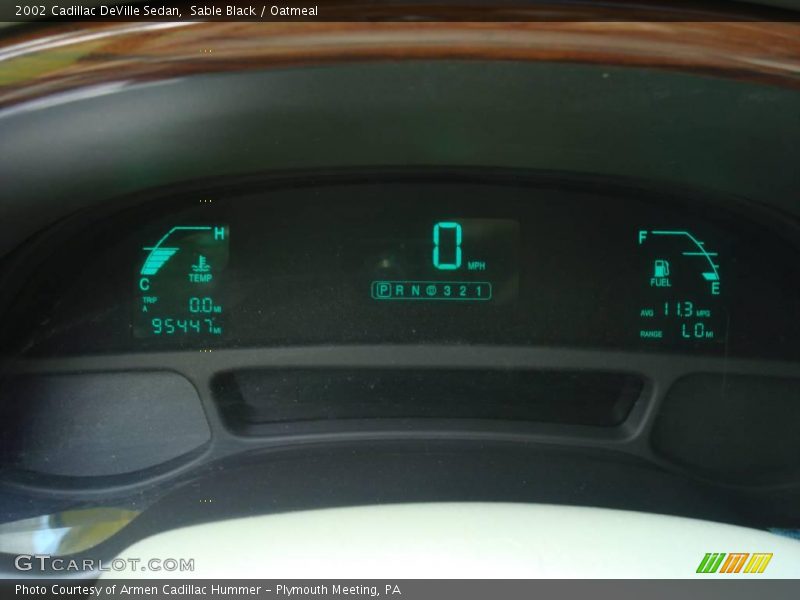 Sable Black / Oatmeal 2002 Cadillac DeVille Sedan