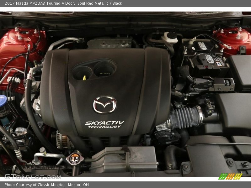 Soul Red Metallic / Black 2017 Mazda MAZDA3 Touring 4 Door