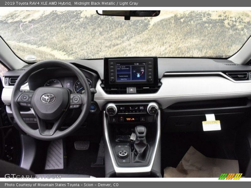 Midnight Black Metallic / Light Gray 2019 Toyota RAV4 XLE AWD Hybrid