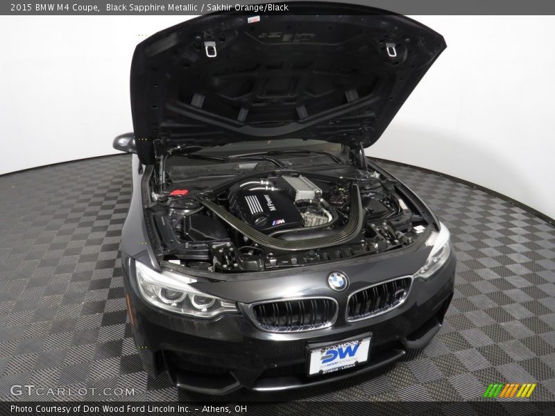 Black Sapphire Metallic / Sakhir Orange/Black 2015 BMW M4 Coupe