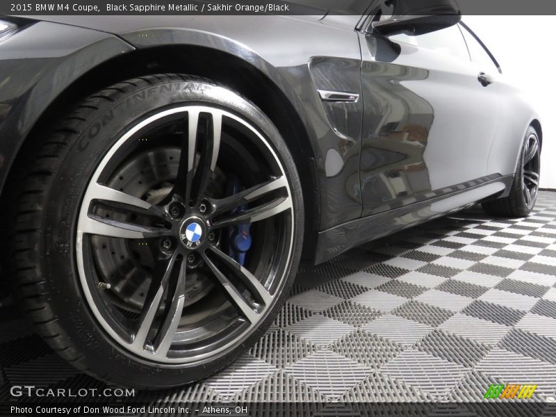 Black Sapphire Metallic / Sakhir Orange/Black 2015 BMW M4 Coupe