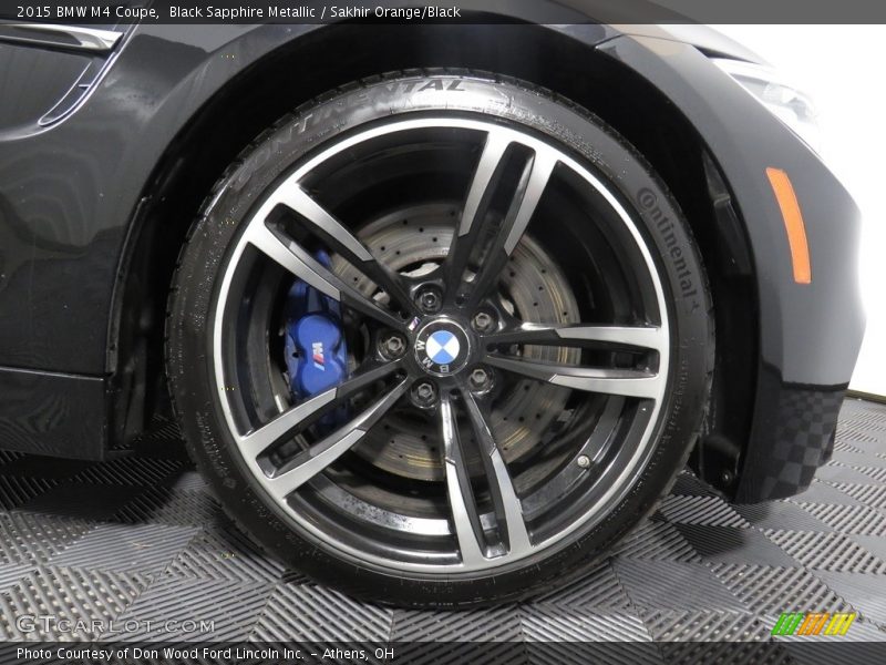Black Sapphire Metallic / Sakhir Orange/Black 2015 BMW M4 Coupe