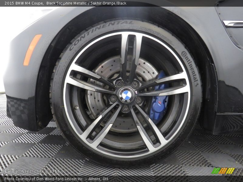 Black Sapphire Metallic / Sakhir Orange/Black 2015 BMW M4 Coupe
