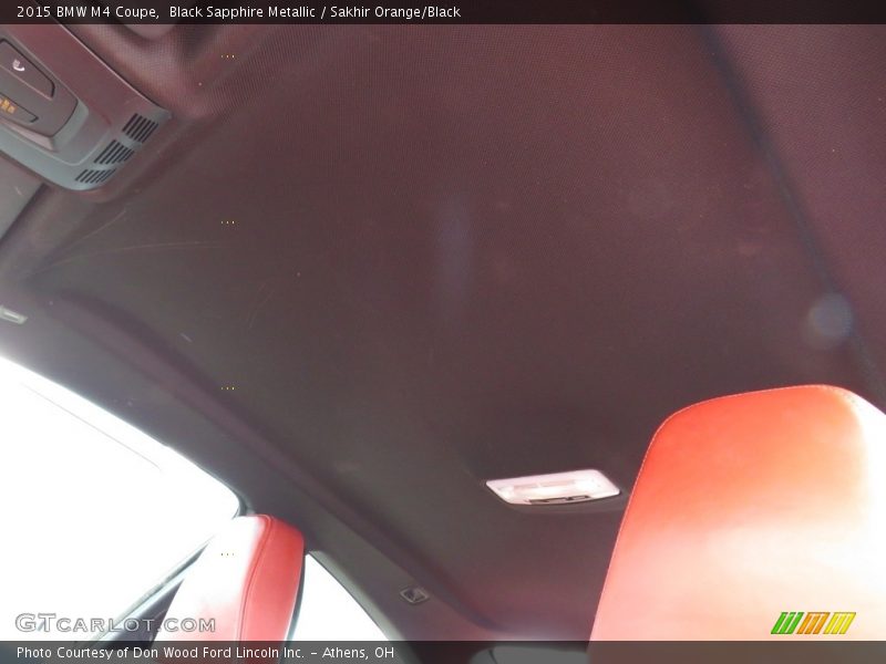 Black Sapphire Metallic / Sakhir Orange/Black 2015 BMW M4 Coupe