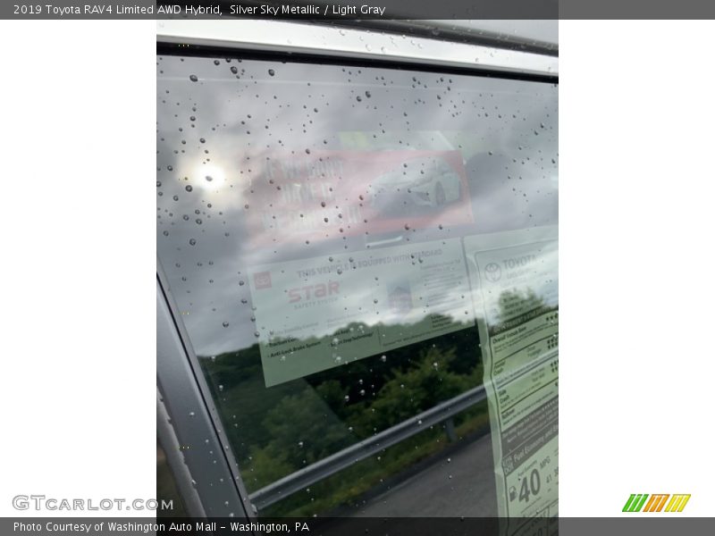 Silver Sky Metallic / Light Gray 2019 Toyota RAV4 Limited AWD Hybrid