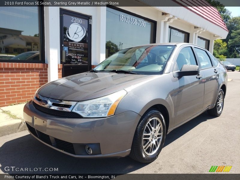 Sterling Grey Metallic / Medium Stone 2010 Ford Focus SE Sedan
