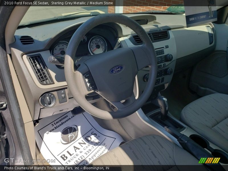 Sterling Grey Metallic / Medium Stone 2010 Ford Focus SE Sedan