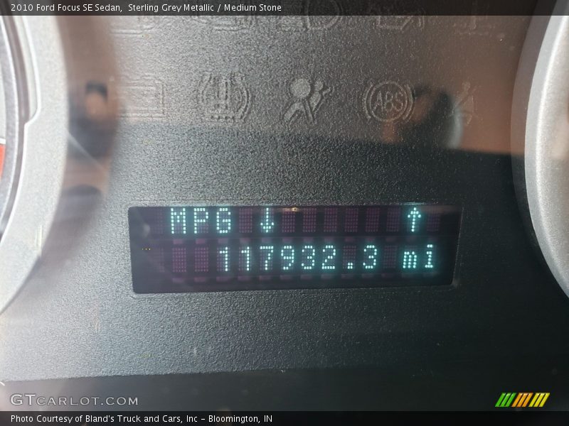 Sterling Grey Metallic / Medium Stone 2010 Ford Focus SE Sedan