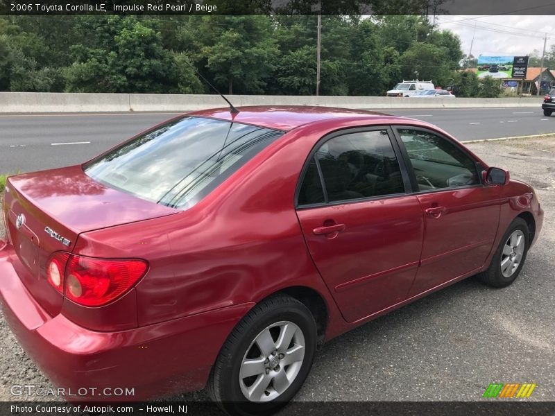 Impulse Red Pearl / Beige 2006 Toyota Corolla LE