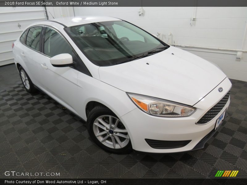 Oxford White / Medium Light Stone 2018 Ford Focus SE Sedan