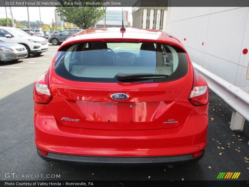 Race Red / Medium Light Stone 2013 Ford Focus SE Hatchback