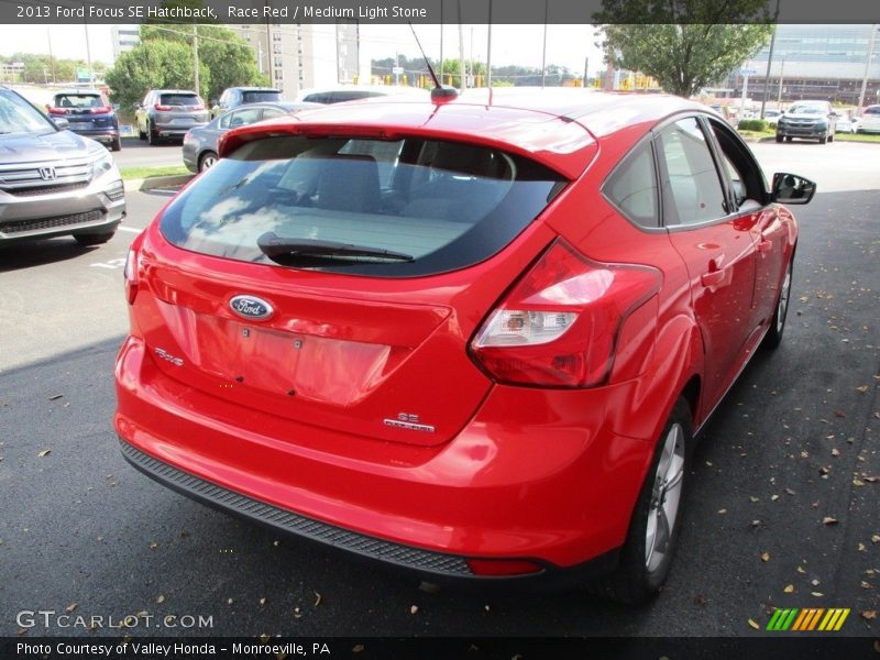 Race Red / Medium Light Stone 2013 Ford Focus SE Hatchback