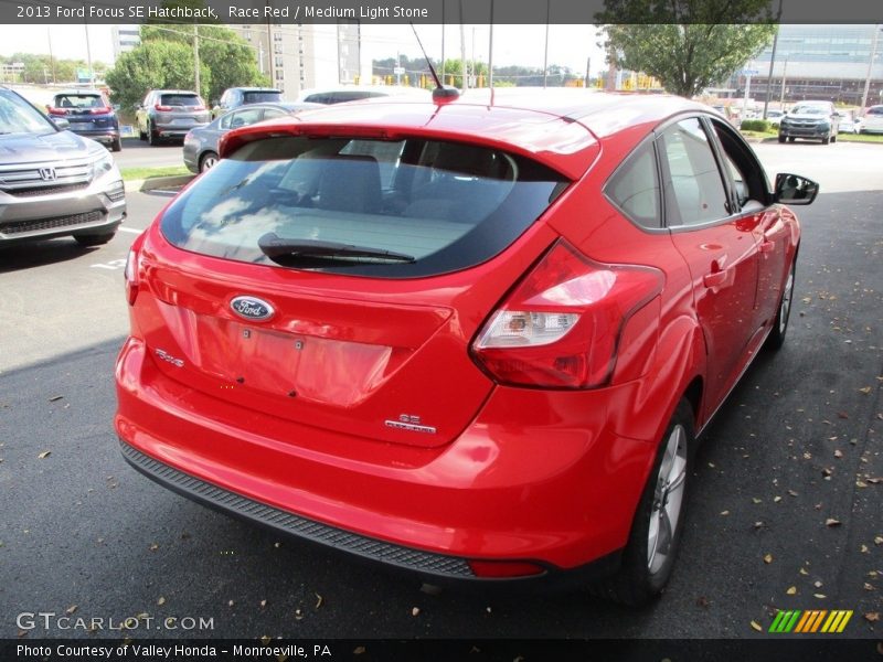 Race Red / Medium Light Stone 2013 Ford Focus SE Hatchback