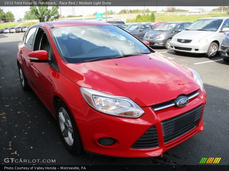 Race Red / Medium Light Stone 2013 Ford Focus SE Hatchback