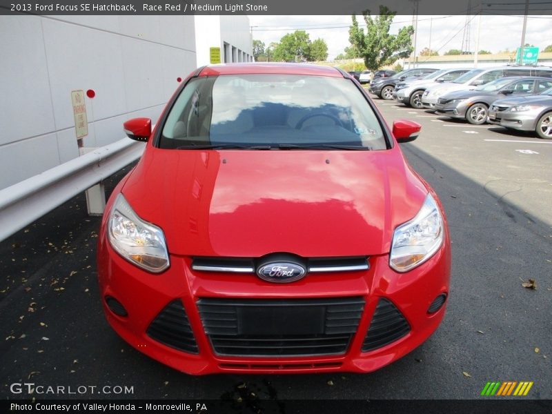 Race Red / Medium Light Stone 2013 Ford Focus SE Hatchback