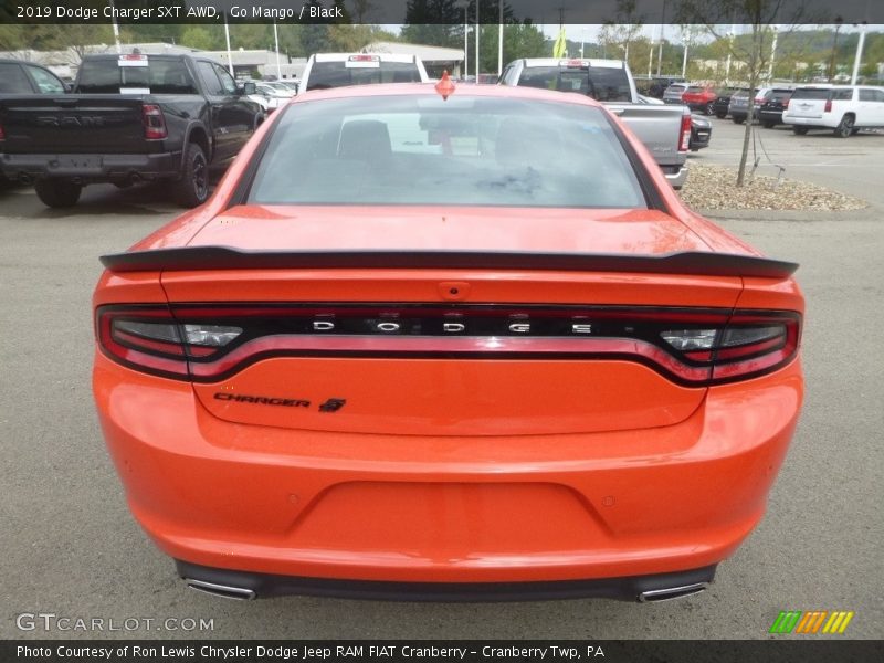 Go Mango / Black 2019 Dodge Charger SXT AWD