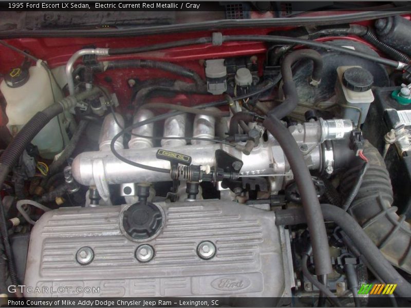 Electric Current Red Metallic / Gray 1995 Ford Escort LX Sedan