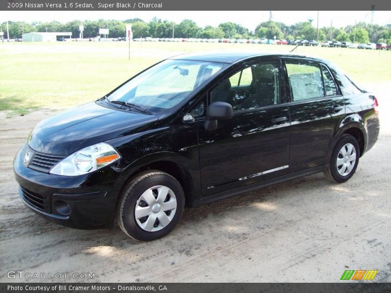 Super Black / Charcoal 2009 Nissan Versa 1.6 Sedan